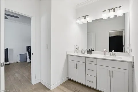 a bathroom with a toilet a sink and a mirror