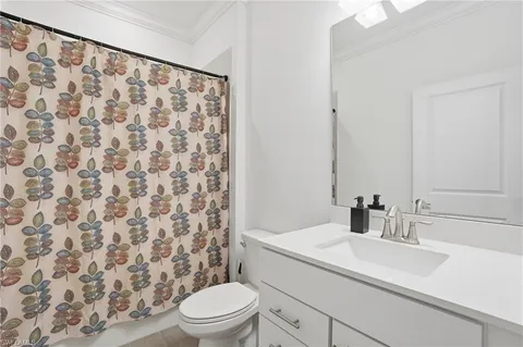 a large white bed in a white room