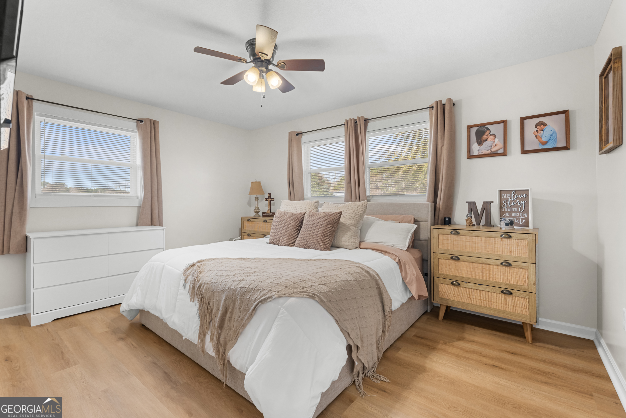 664 Boyd School Road Sylvania, GA 30467 - Photo 13 of 33 a bedroom with a bed and a chandelier