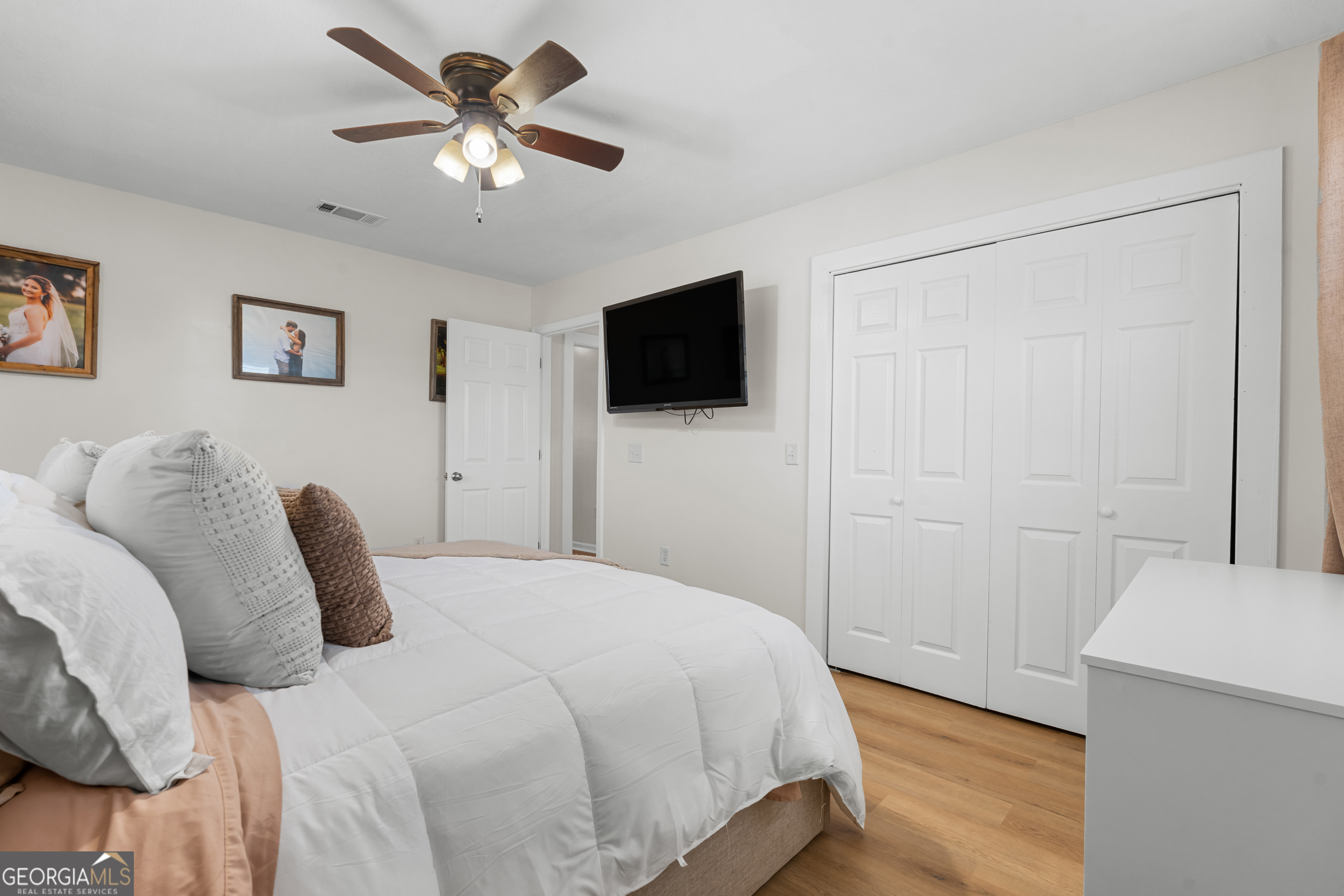 664 Boyd School Road Sylvania, GA 30467 - Photo 14 of 33 a bedroom with a bed and a flat screen tv