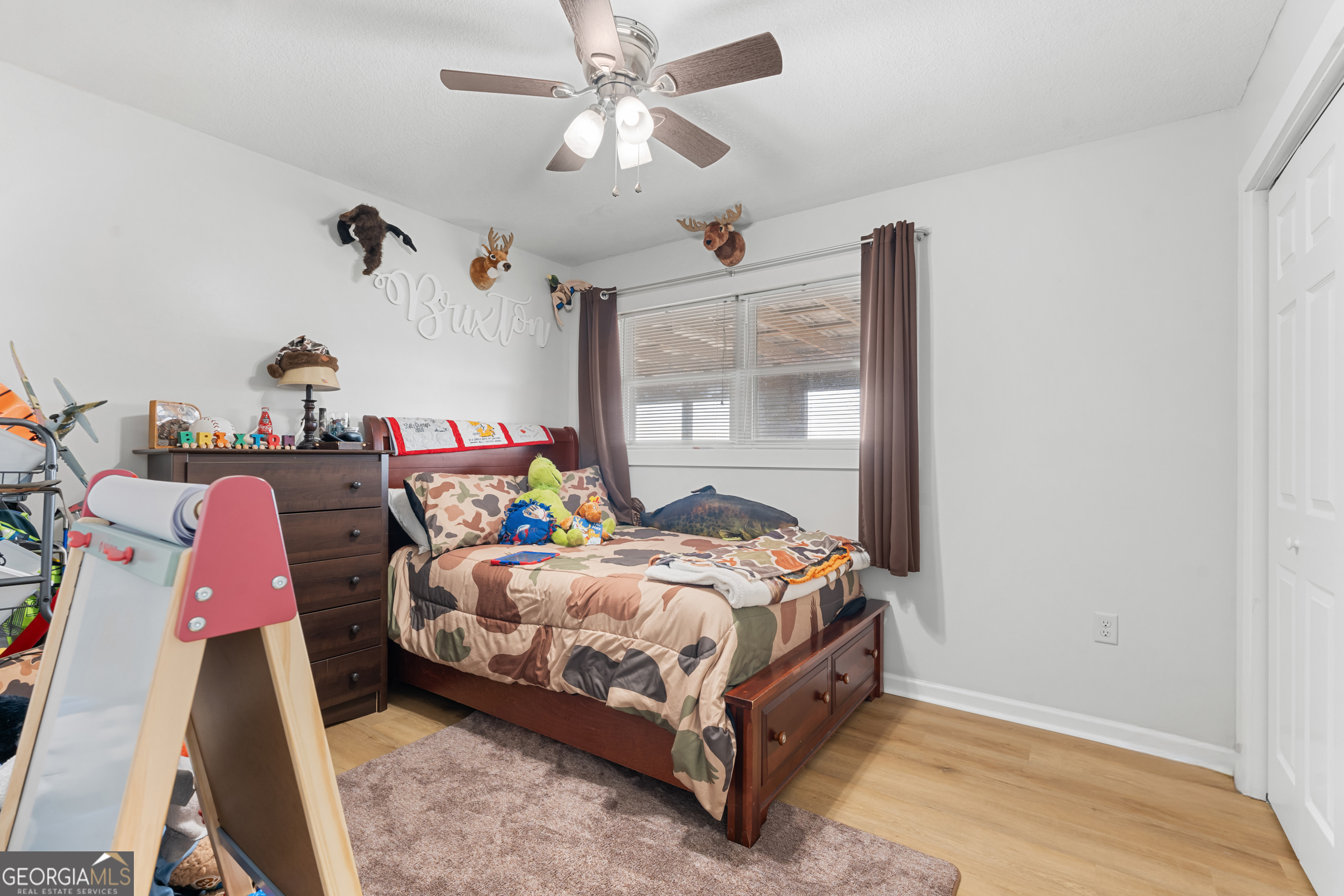664 Boyd School Road Sylvania, GA 30467 - Photo 18 of 33 a bedroom with a bed and wooden floor