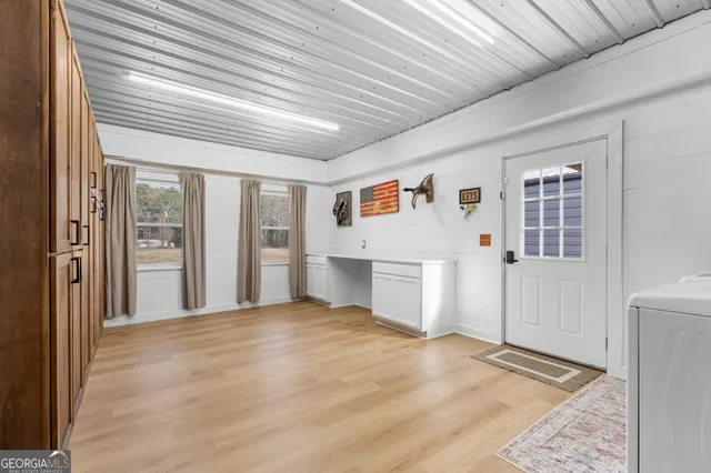 a bathroom with a sink a toilet and shower curtain
