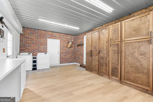 a view of a hall with wooden floor