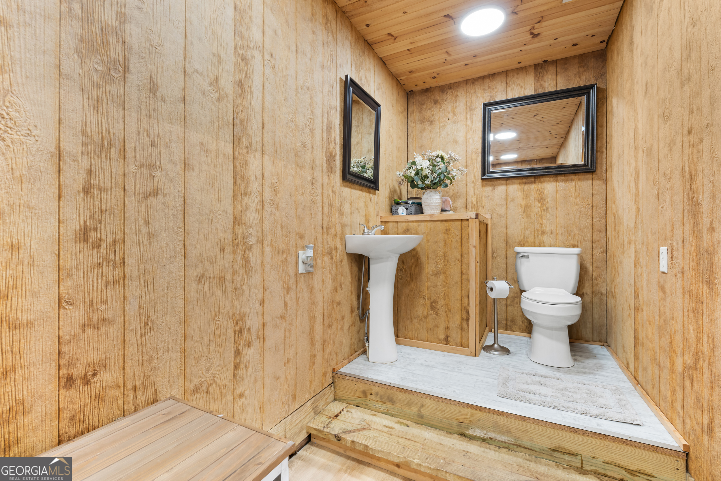 664 Boyd School Road Sylvania, GA 30467 - Photo 21 of 33 a bathroom with a sink a toilet and shower curtain
