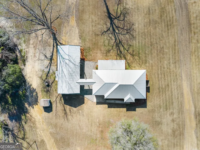 a view of a swimming pool with a yard