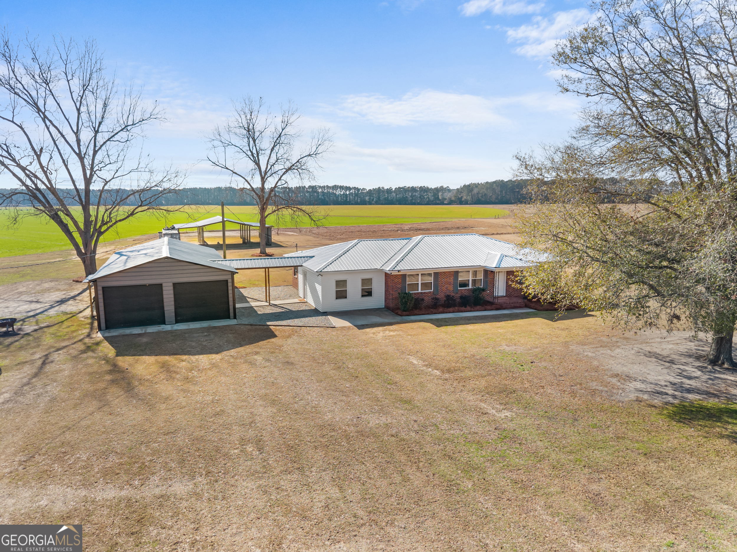 664 Boyd School Road Sylvania, GA 30467 - Photo 4 of 33 a swimming pool with outdoor seating and yard