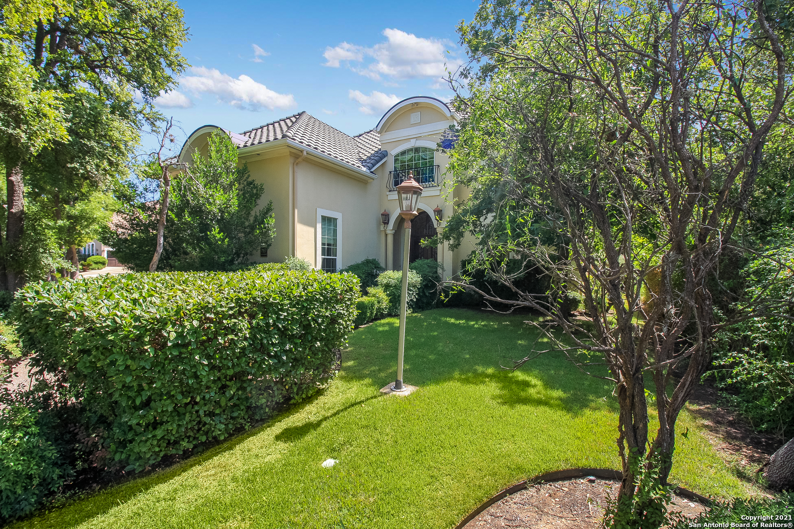 7327 Hovingham San Antonio, TX 78257 - Photo 25 of 26 a view of a house with a backyard and a tree