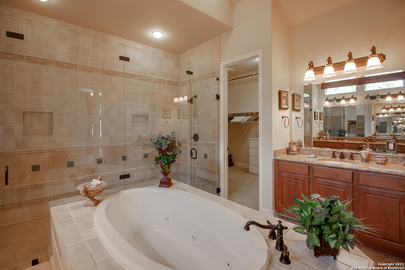 7327 Hovingham San Antonio, TX 78257 - Photo 10 of 26 a bathroom with a tub sink and mirror