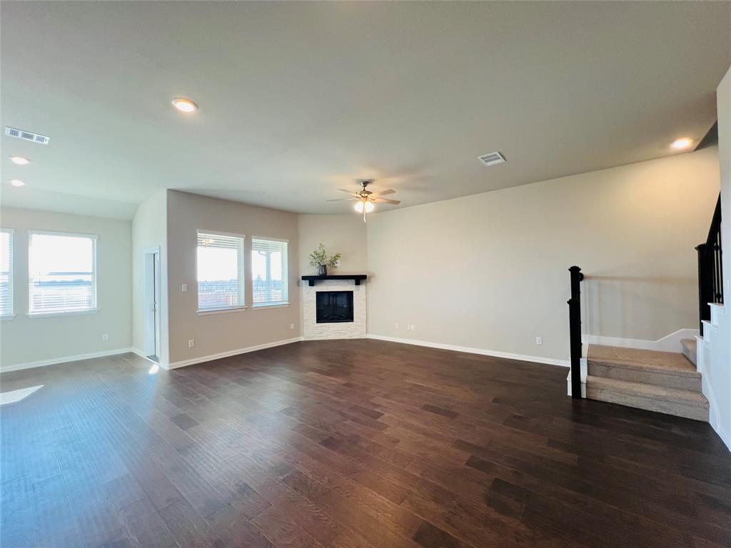 3305 Cross Shr Drive Anna, TX 75409 - Photo 7 of 31 Unfurnished living room with ceiling fan and dark hardwood / wood-style flooring