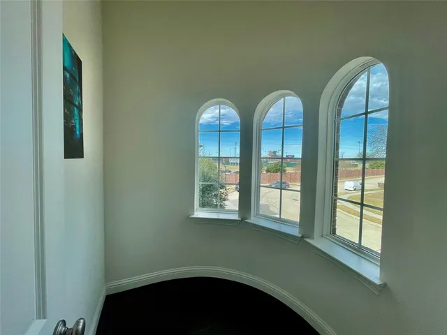 a view of a livingroom with furniture and window