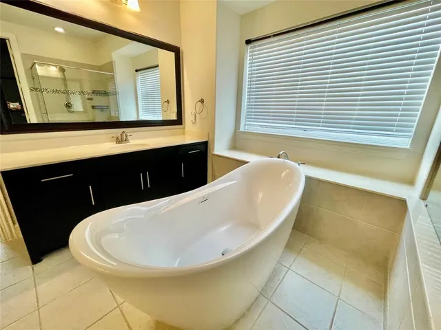 a bathroom with a bathtub and a sink
