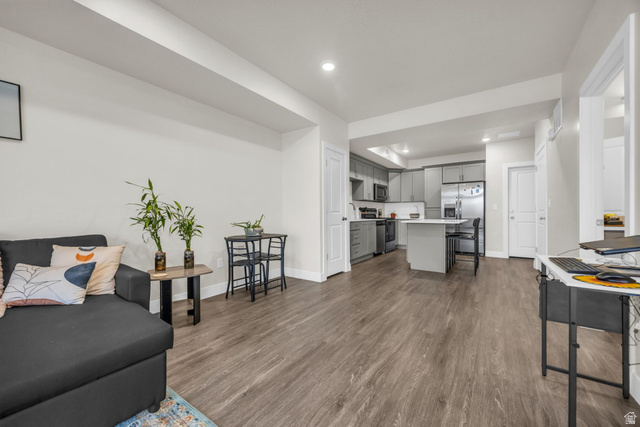 2101 North Main Street, Unit 409 Sunset, UT 84015 - Photo 4 of 18 Living area with recessed lighting and dark wood finished floors