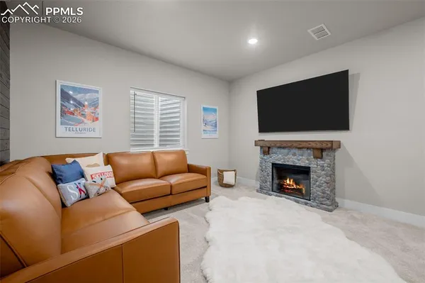 a living room with furniture and a window