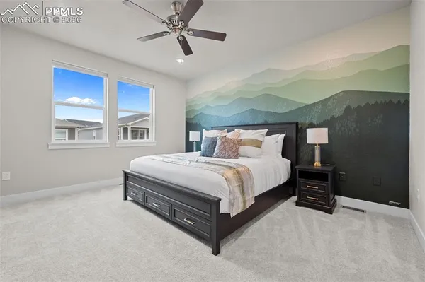 a bedroom with a bed lamp closet and window