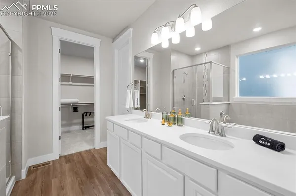 a bathroom with a sink a vanity and a mirror