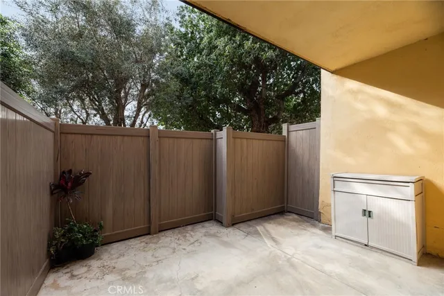 a view of backyard with potted plants