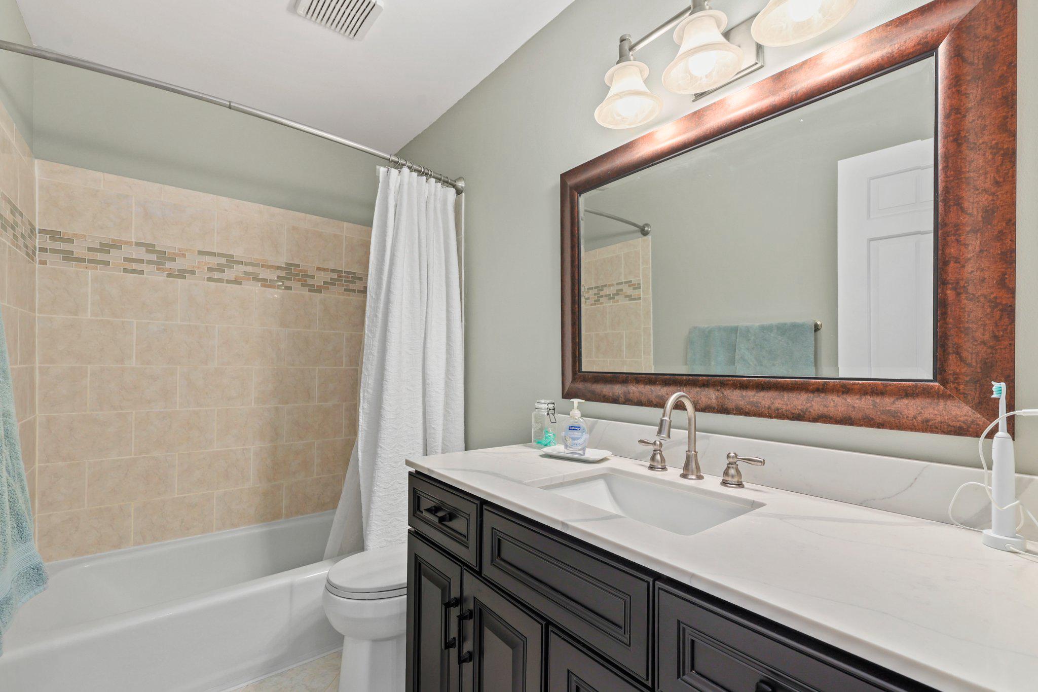 7357 Auburn Mill Road Warrenton, VA 20187 - Photo 15 of 35 Renovated & Elegant Hallway bath w/quartz counter.