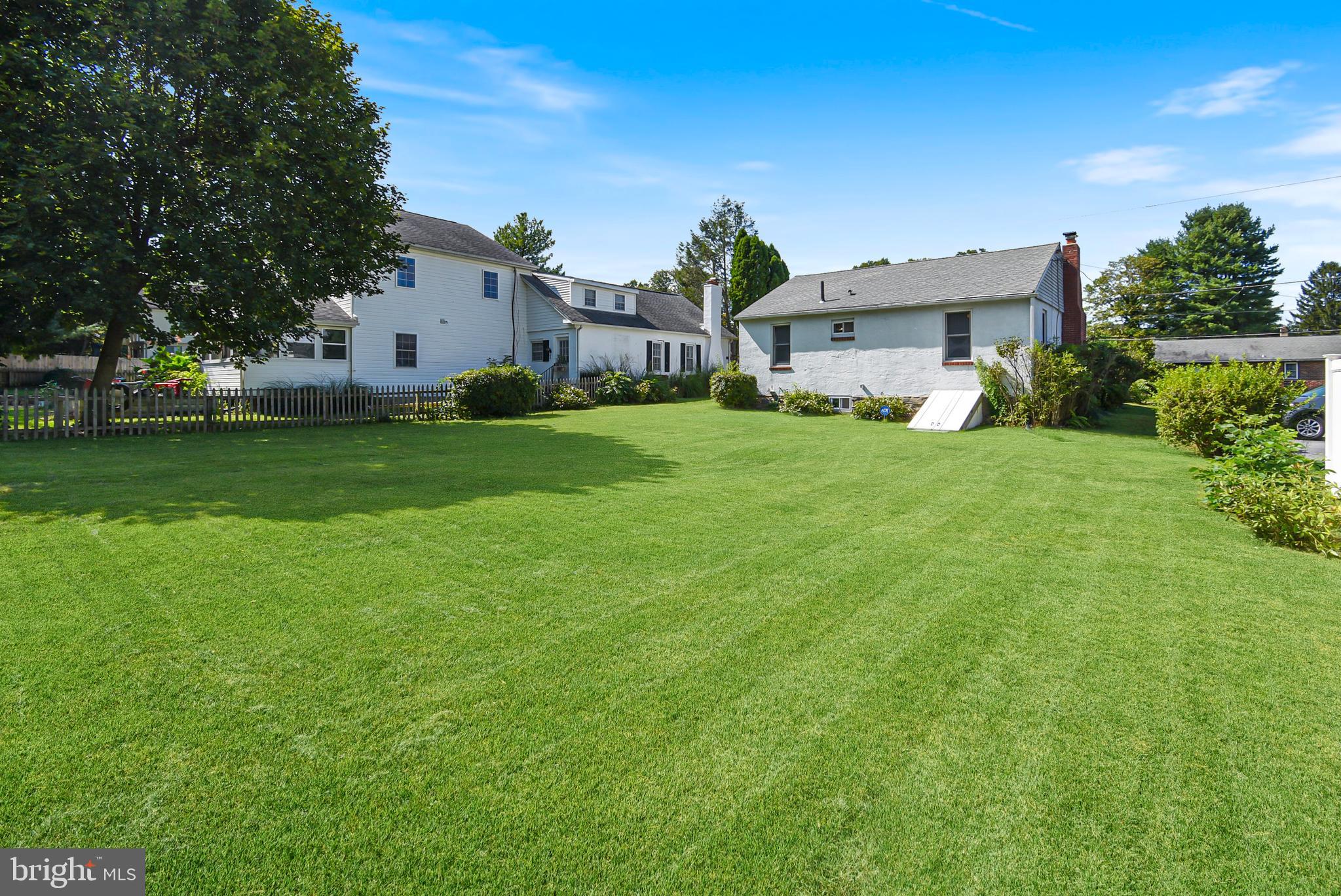 115 Locust Street Newtown Square, PA 19073 - Photo 16 of 17 a front view of a house with garden