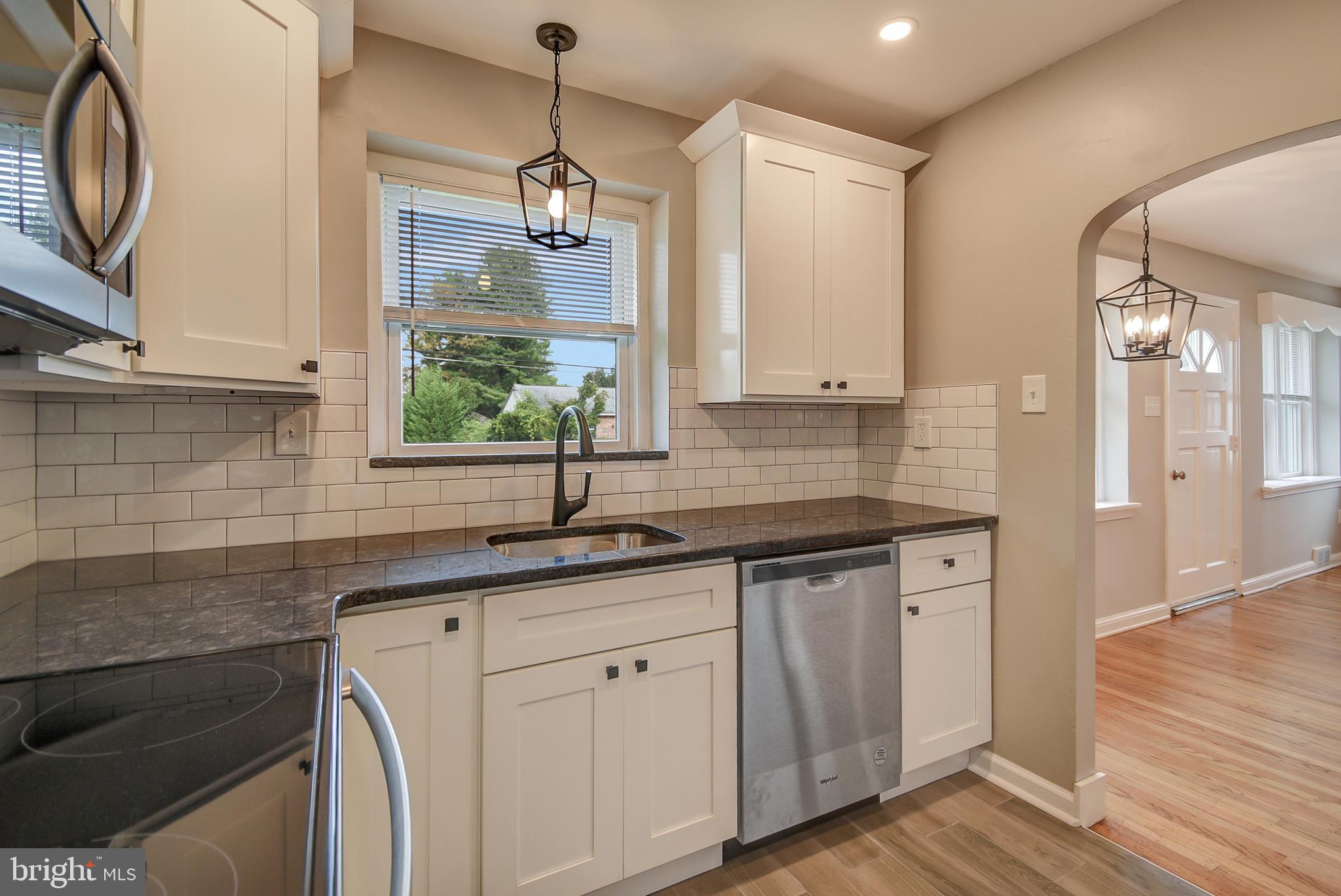 115 Locust Street Newtown Square, PA 19073 - Photo 2 of 17 a kitchen with a sink and a window