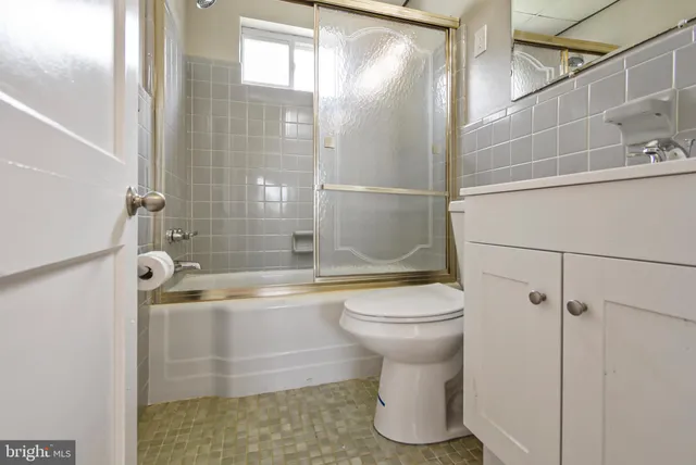 a bathroom with a shower and a toilet