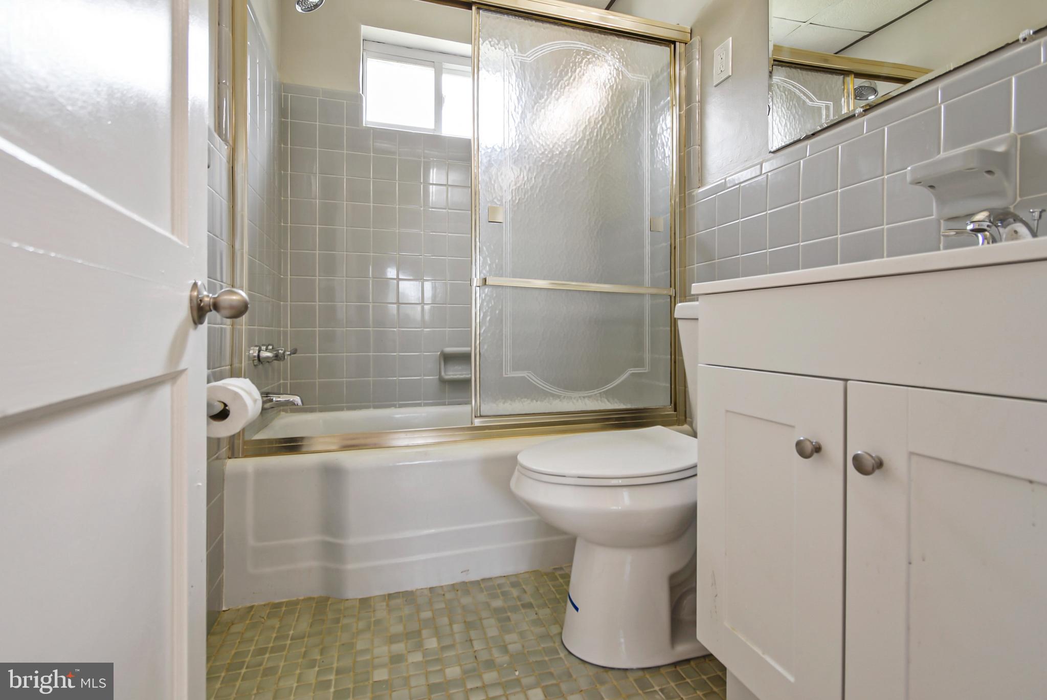 115 Locust Street Newtown Square, PA 19073 - Photo 8 of 17 a bathroom with a shower and a toilet