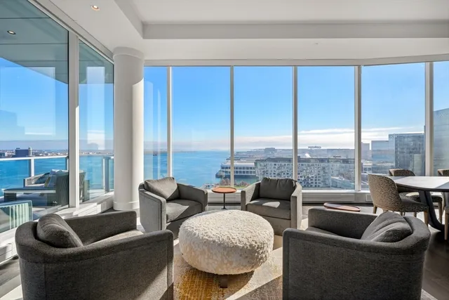 a kitchen with counter top space a sink cabinets and wooden floor