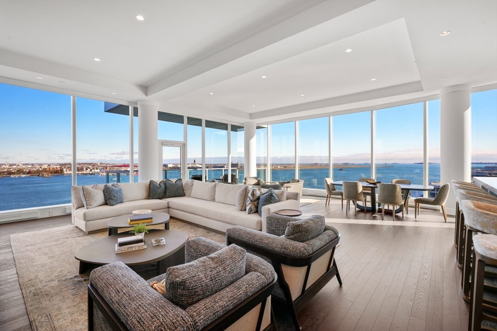 50 Liberty Drive, Unit PH1B Boston, MA 02210 - Photo 2 of 32 a living room with furniture and floor to ceiling windows