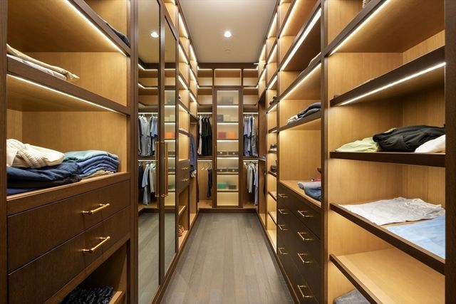 a living room with furniture a rug and a window