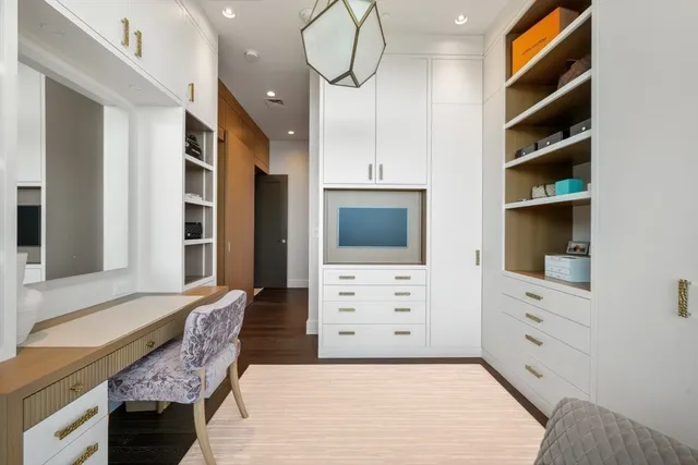 a bathroom with a bathtub shower sink and mirror