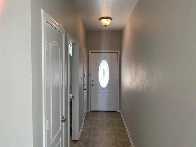 a view of a bathroom with a sink and a mirror