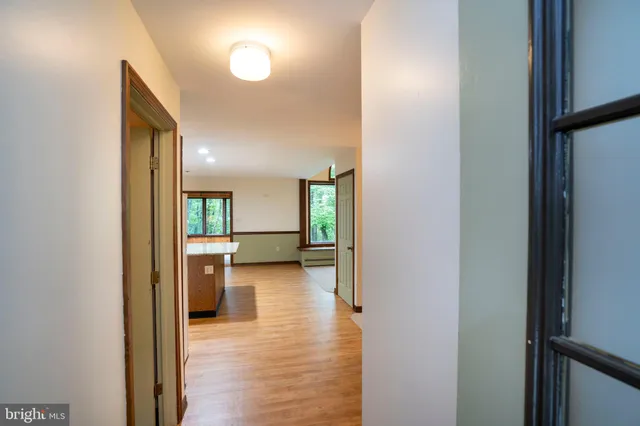 a kitchen with stainless steel appliances granite countertop a refrigerator a stove top oven and a sink