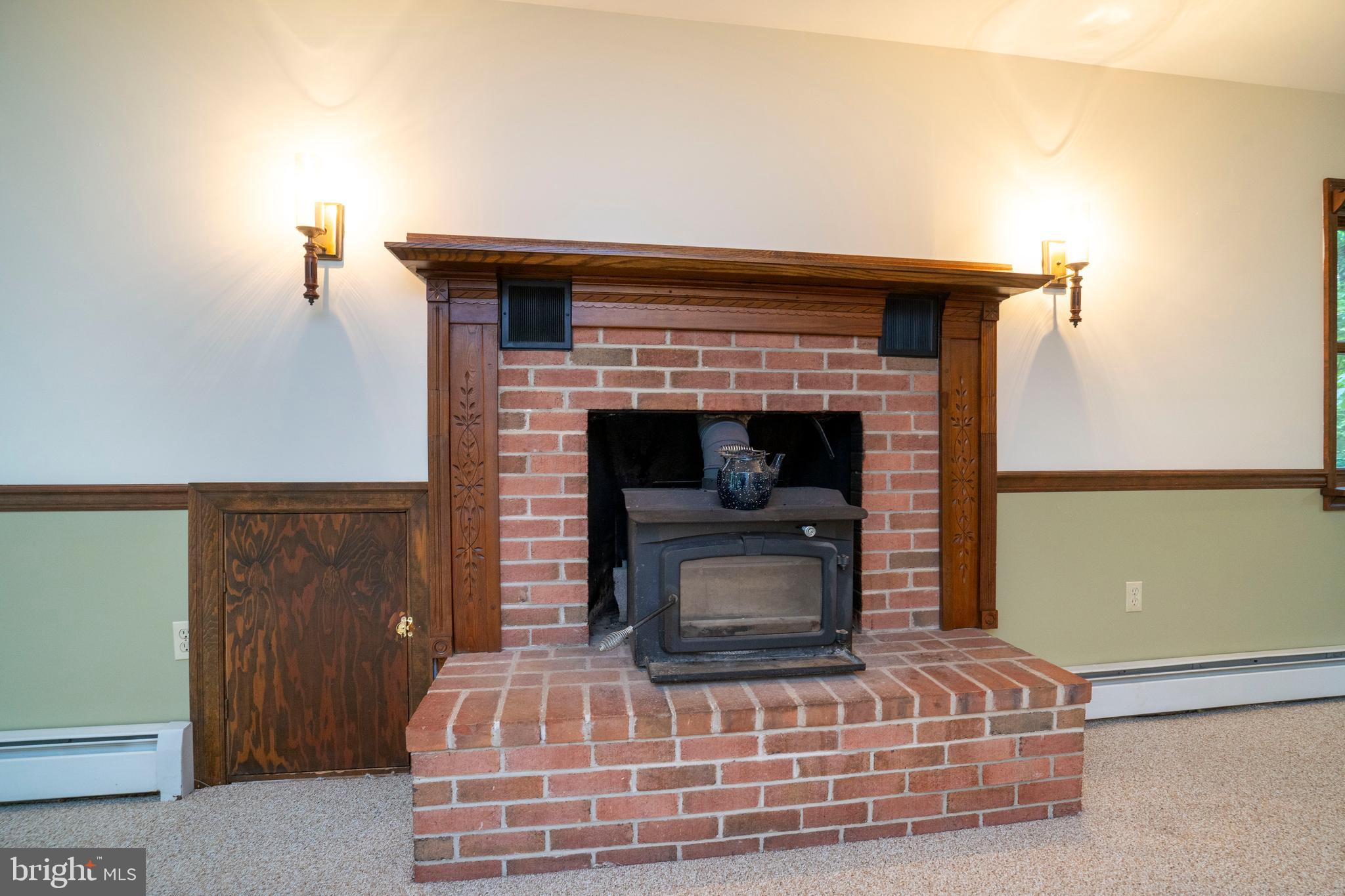 1040 Radio Club Road Montoursville, PA 17754 - Photo 25 of 58 a living room with fireplace and a wooden floor