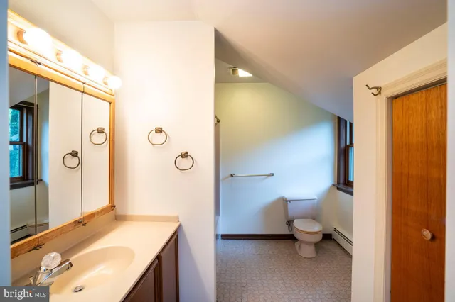 a bathroom with a sink and mirror