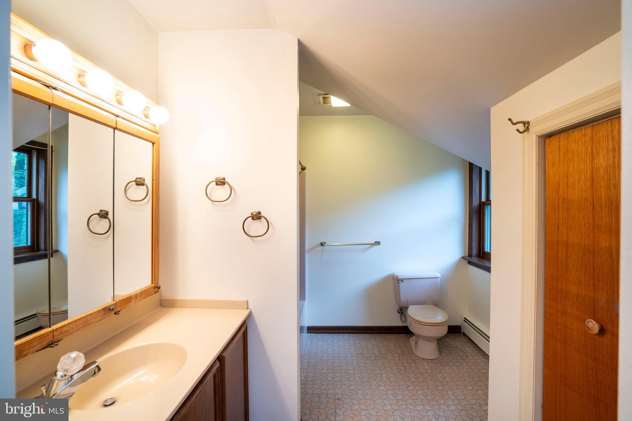 1040 Radio Club Road Montoursville, PA 17754 - Photo 36 of 58 a en suite bathroom with a sink and a mirror