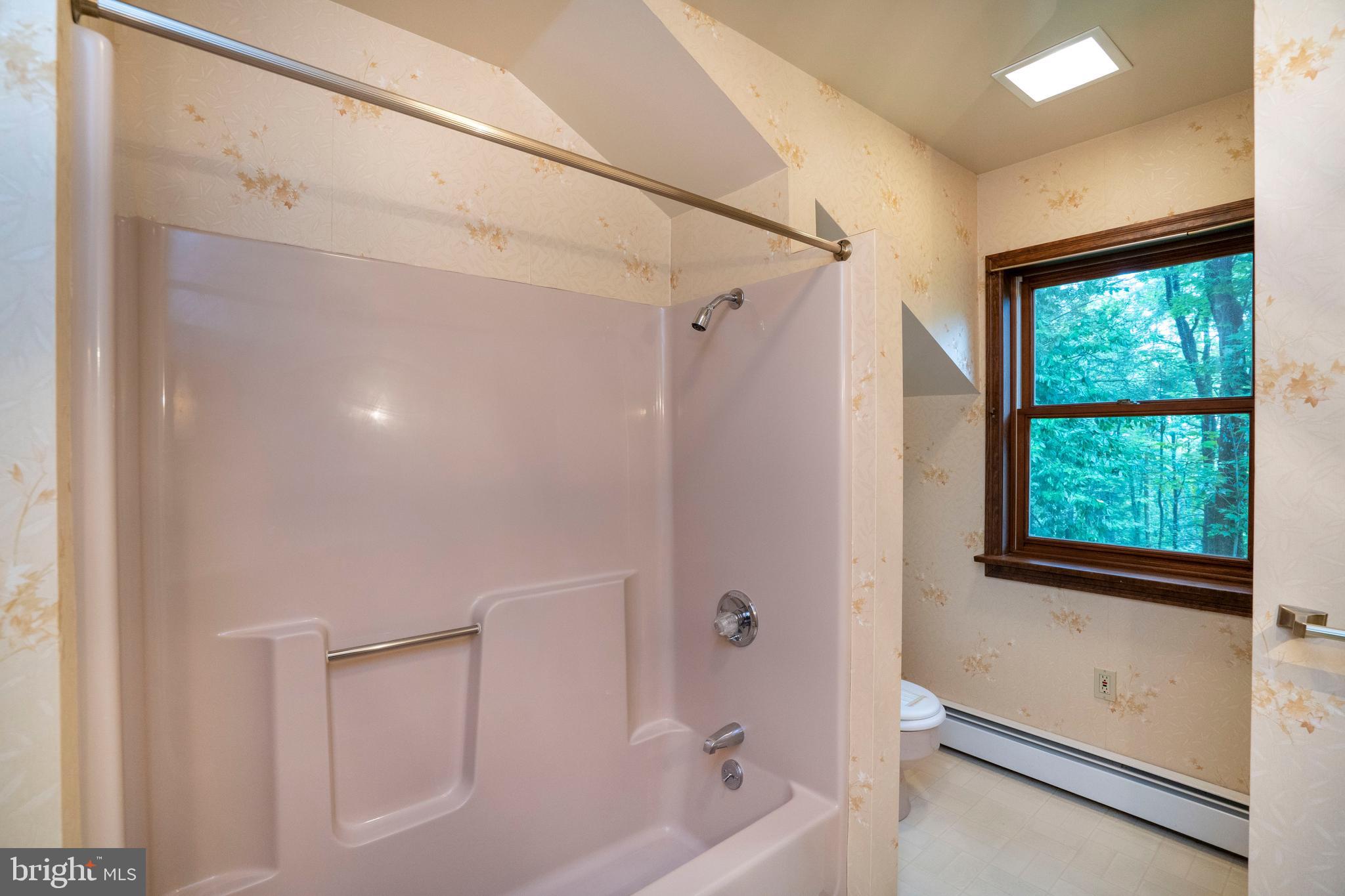 1040 Radio Club Road Montoursville, PA 17754 - Photo 40 of 58 a bathroom with a bathtub and a shower