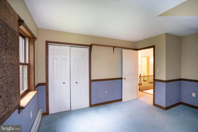 a view of an empty room with racks on the wall