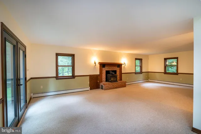 a view of an empty room with stairs