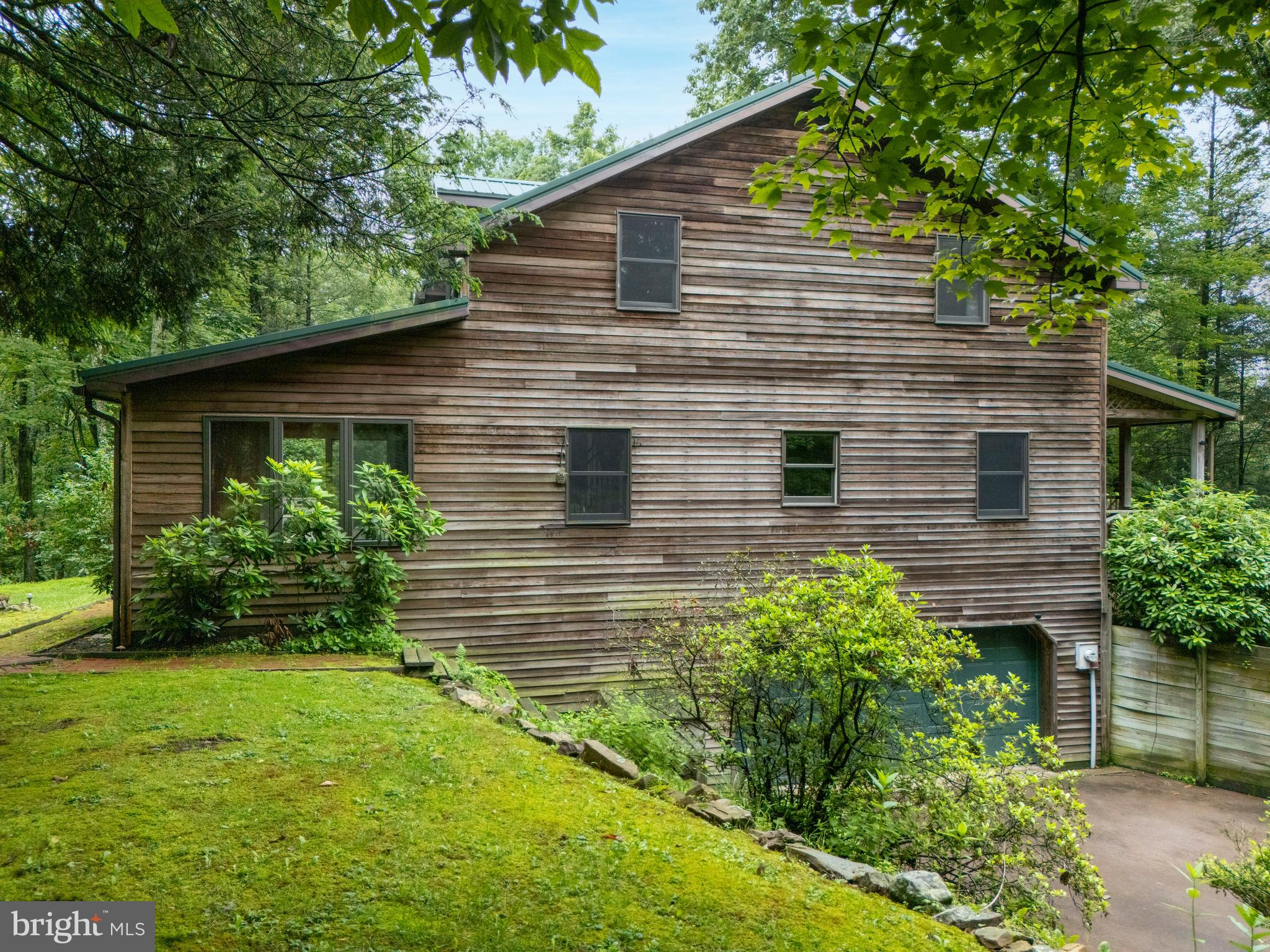 1040 Radio Club Road Montoursville, PA 17754 - Photo 54 of 58 a view of a backyard with plants and large tree