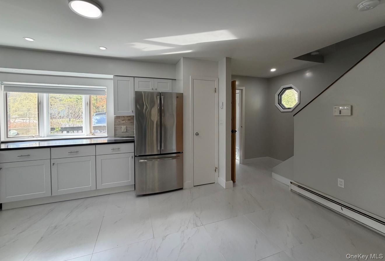 60 Medallion Road Kiamesha Lake, NY 12751 - Photo 18 of 44 a kitchen with refrigerator and window
