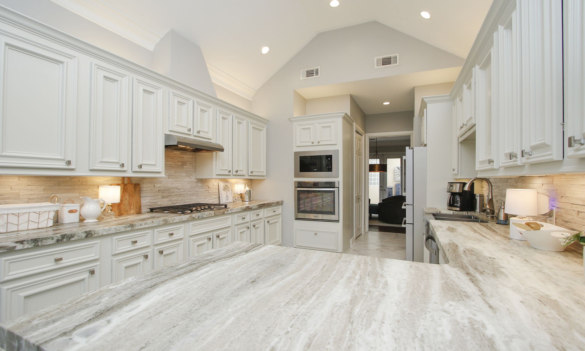 16610 Manningtree Lane Spring, TX 77379 - Photo 26 of 50 All appliances are high end stainless and includes a five-burner gas stove top. The kitchen also has two pantries.