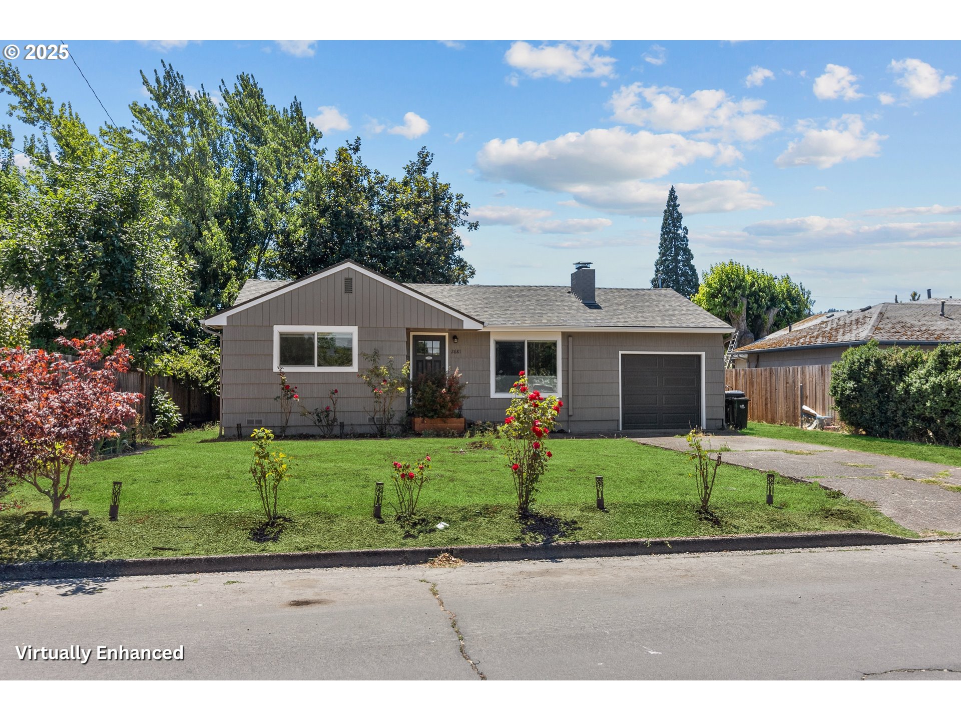 2681 D Street Springfield, OR 97477 - Photo 1 of 24 a front view of a house with a yard and garage
