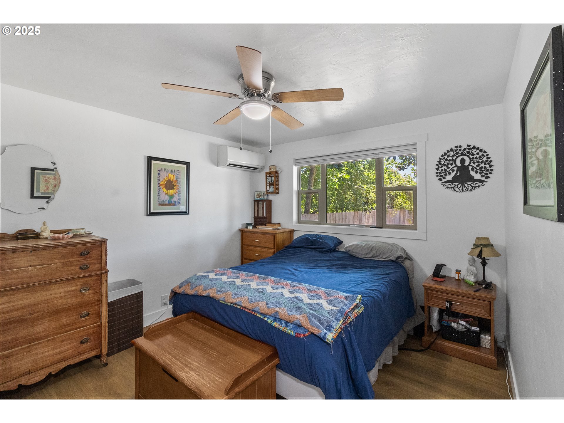 2681 D Street Springfield, OR 97477 - Photo 20 of 24 a bedroom with a bed and a chandelier