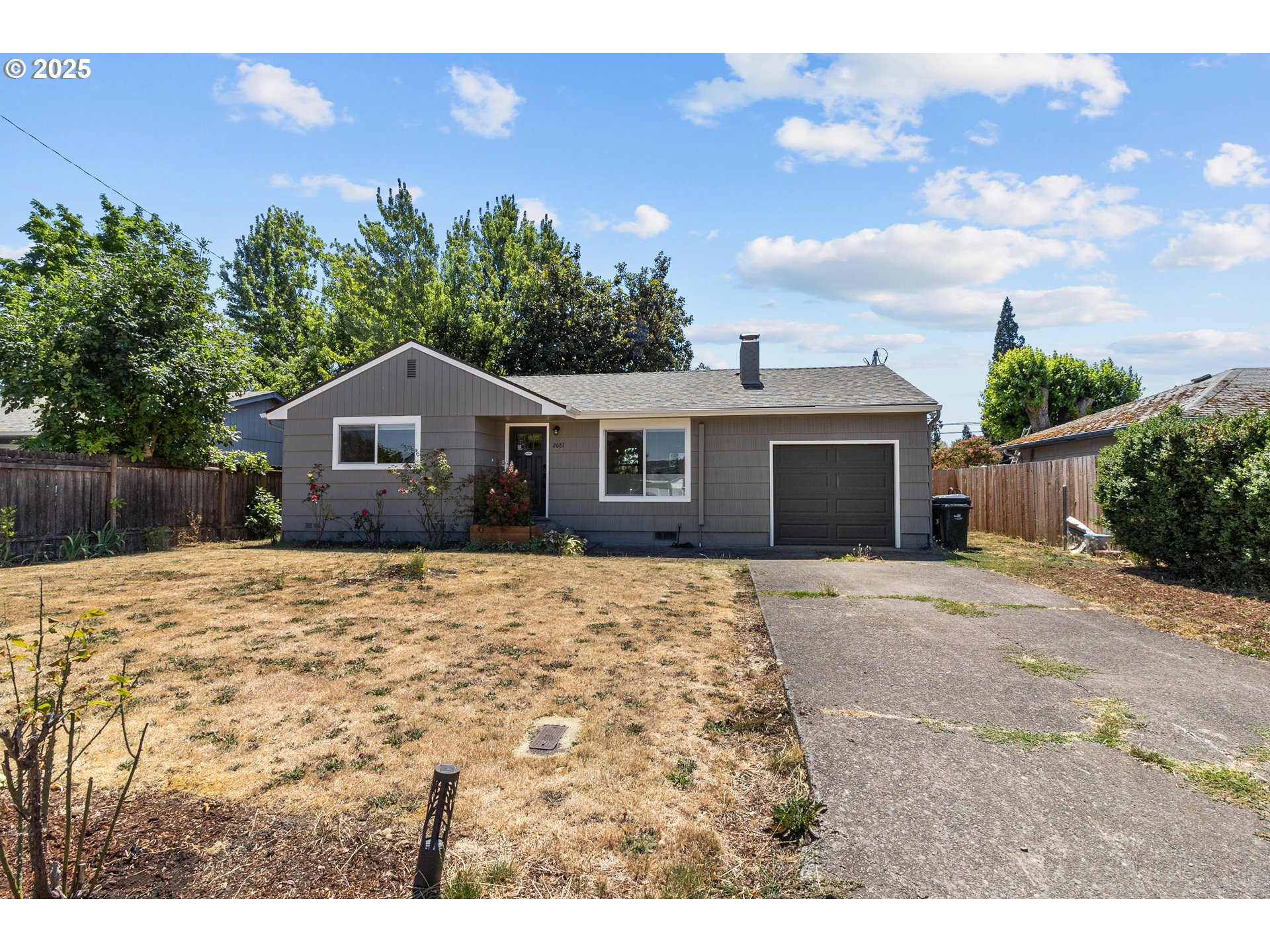 2681 D Street Springfield, OR 97477 - Photo 21 of 24 a house with trees in the background