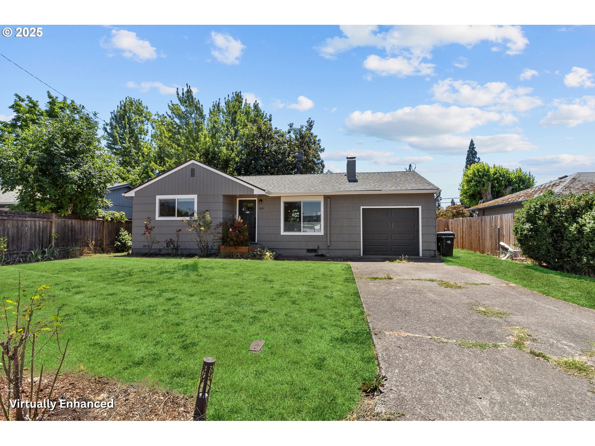 2681 D Street Springfield, OR 97477 - Photo 3 of 24 a yellow and red house with a garden