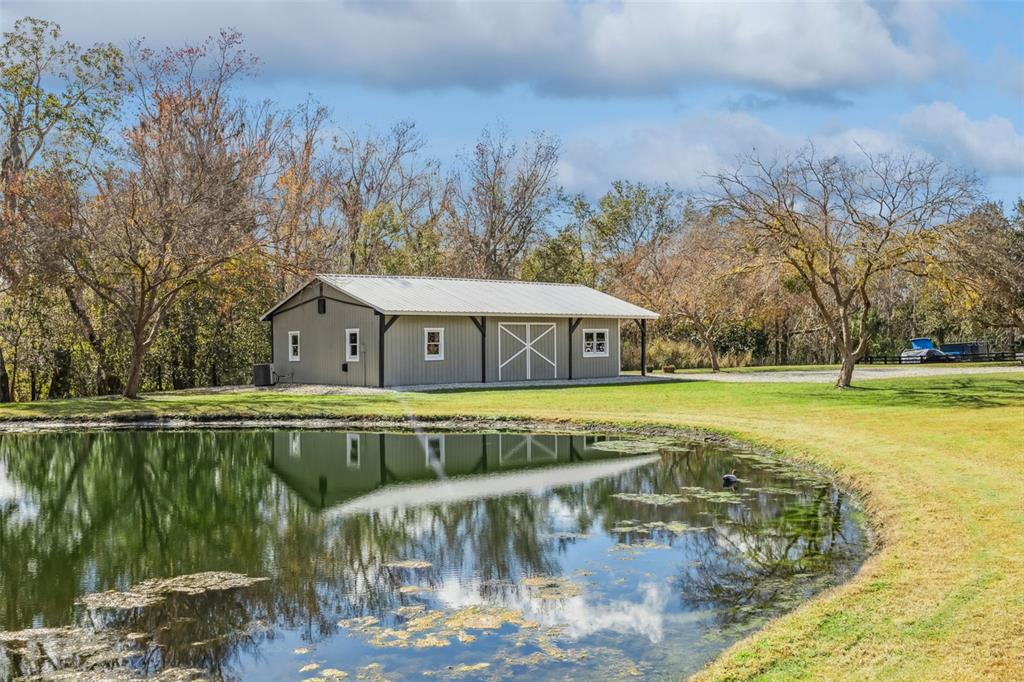 323 McLain Lane Geneva, FL 32732 - Photo 12 of 70 a view of a swimming pool with a patio