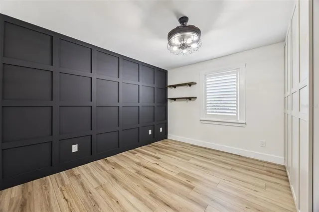 front view of a house with swimming pool and a yard