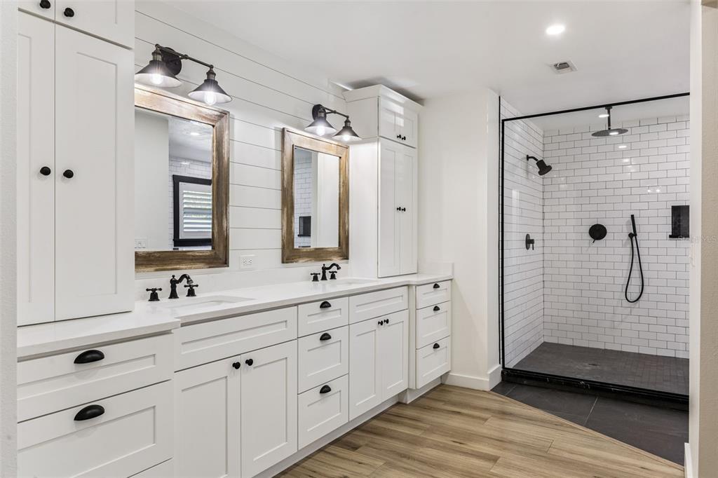 323 McLain Lane Geneva, FL 32732 - Photo 24 of 70 a bathroom with a double vanity sink mirror double and shower