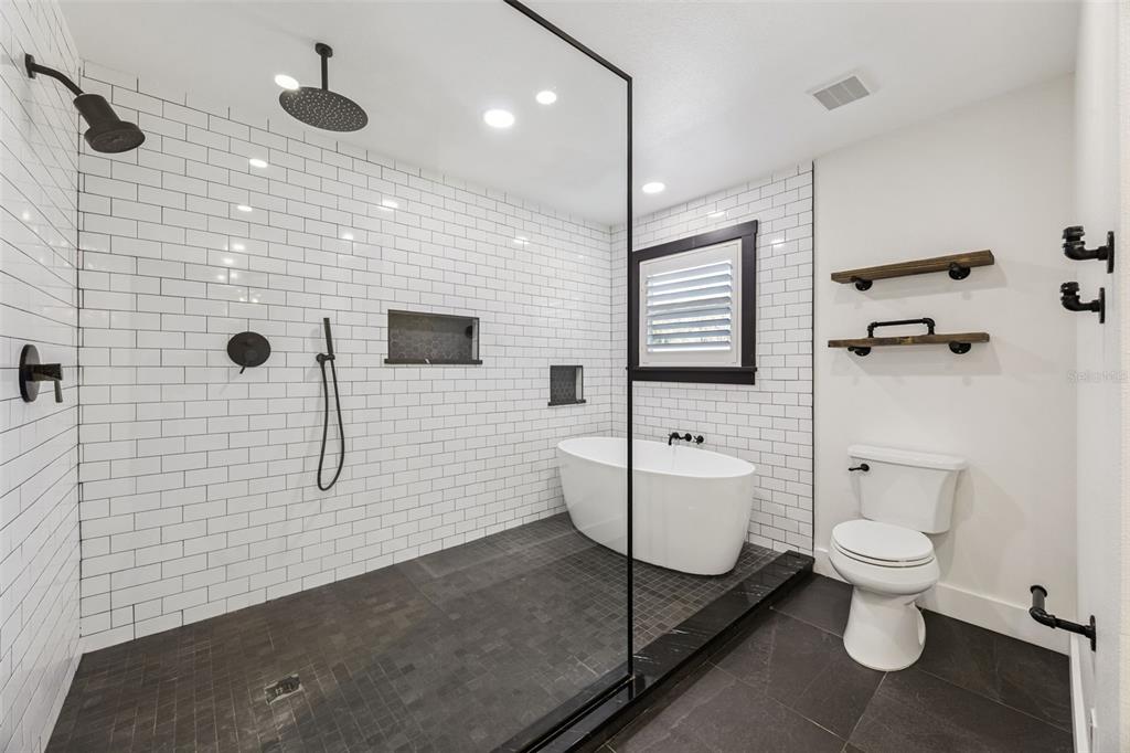 323 McLain Lane Geneva, FL 32732 - Photo 25 of 70 a bathroom with a toilet sink and shower