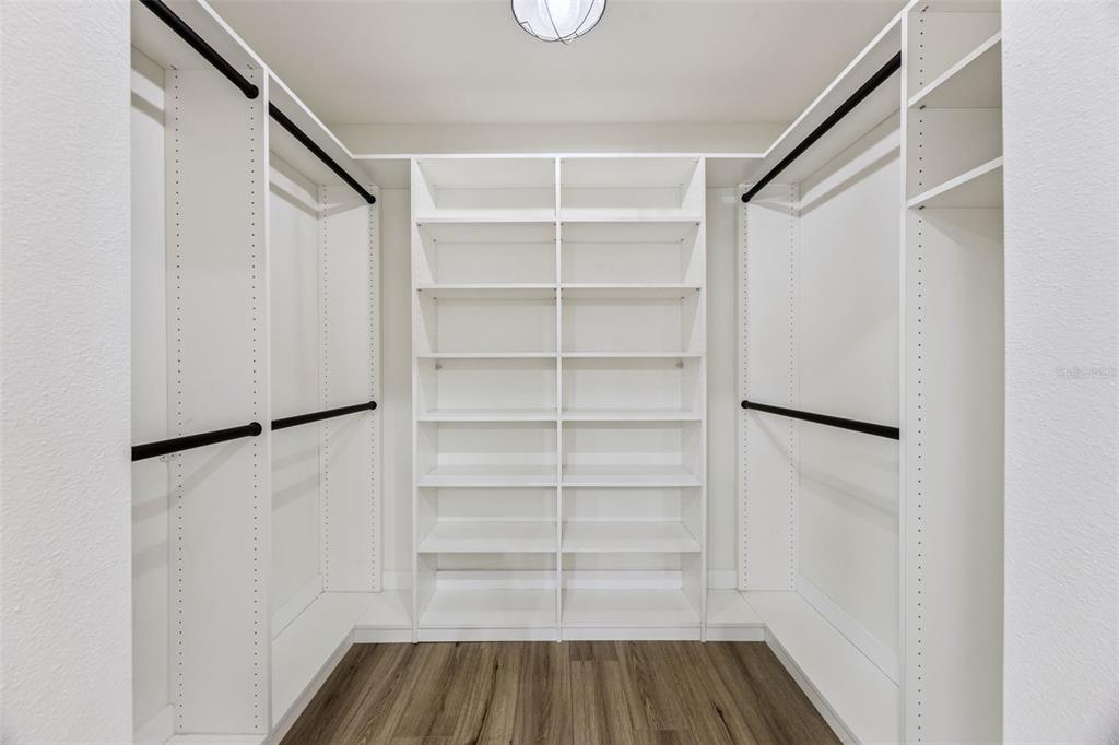 323 McLain Lane Geneva, FL 32732 - Photo 26 of 70 a view of walk in closet with empty racks