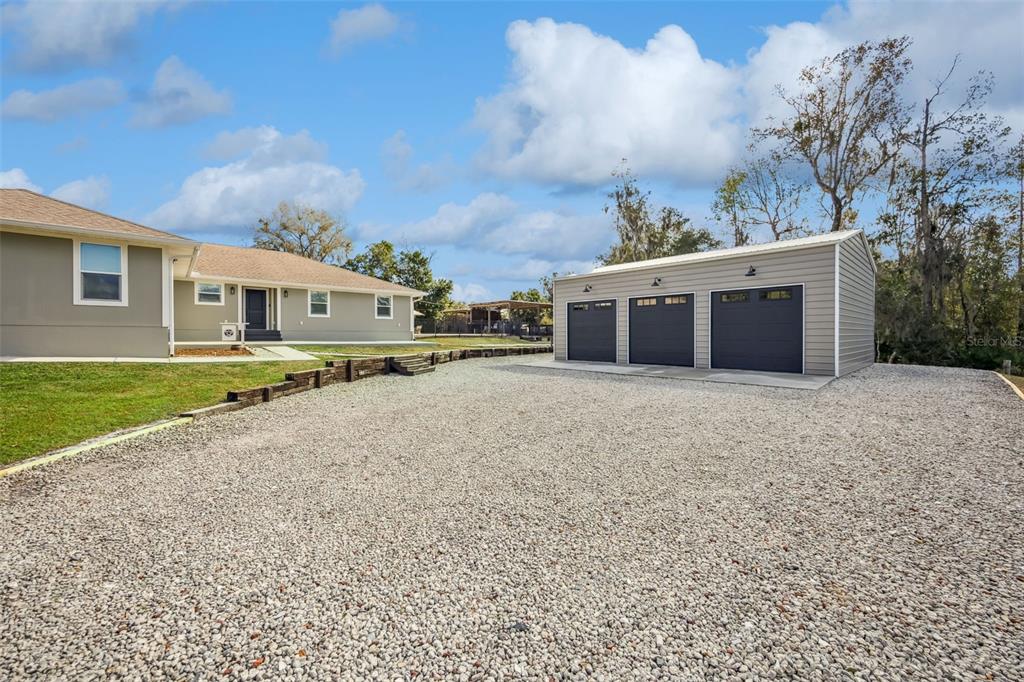 323 McLain Lane Geneva, FL 32732 - Photo 29 of 70 a front view of a house with a yard and lake view
